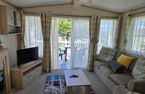 Cowes House | 3 bed caravan with decking sleeps 8 with stunning sea view on private beach in Thorness bay