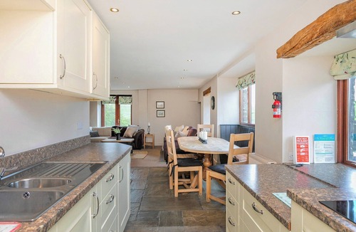 Fence Cottage | An 1800’s barn conversion with beams, exposed stonework and flagged floors.