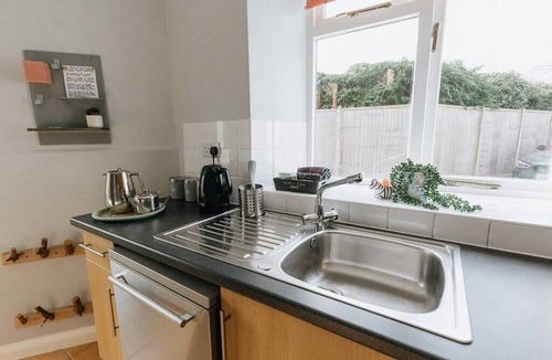 Kendal Cottage | Charming Lake District Cottage Fireplace & Parking