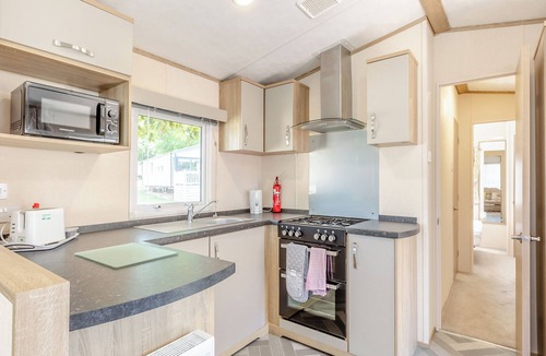 Axminster Apartment | Comfortable and modern 12ft-wide caravan with one double and one twin bedroom.