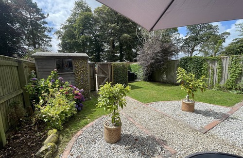 Lanhydrock Cottage | Oozing charm! Character Cottage - Dog Friendly With Luxury Hot tub & Log Burner