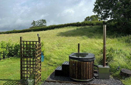 Pentrefelin Cabin | Romantic Shepherd's Hut with hot tub. Ultimate Luxury experience.