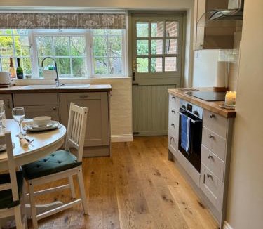 Sidlesham House | Situated in Stunning Highleigh Village,'BRAMLEY FALL COTTAGE'-Attached Cottage,3 Bedrooms-1 on ground level, SLEEPS 6-2 Bathrooms, 9 mins to Sandy Wittering Beach, 5 mins from Southend Barns, Child friendly,Small Breed Dog Friendly 2 max, Parking-EV Point