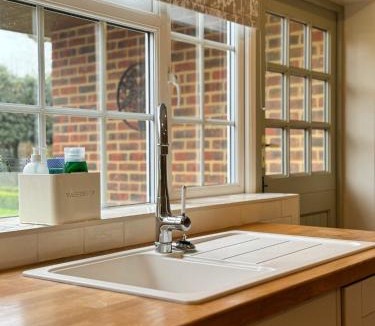 Sidlesham House | Situated in Stunning Highleigh Village,'BRAMLEY FALL COTTAGE'-Attached Cottage,3 Bedrooms-1 on ground level, SLEEPS 6-2 Bathrooms, 9 mins to Sandy Wittering Beach, 5 mins from Southend Barns, Child friendly,Small Breed Dog Friendly 2 max, Parking-EV Point