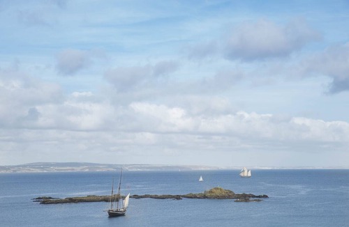 Mousehole House | Spectacular panoramic sea views of Mounts Bay from this light filled home