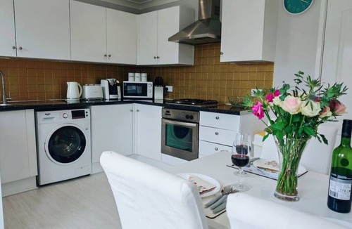 Port Talbot House | Step-free retreat by the sea with garden & parking