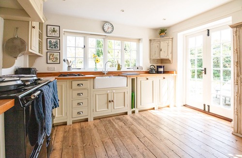 Holworth Cottage | Thatched former post office cottage in chocolate box village close to the sea