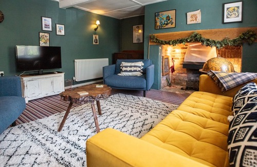 Holworth Cottage | Thatched former post office cottage in chocolate box village close to the sea