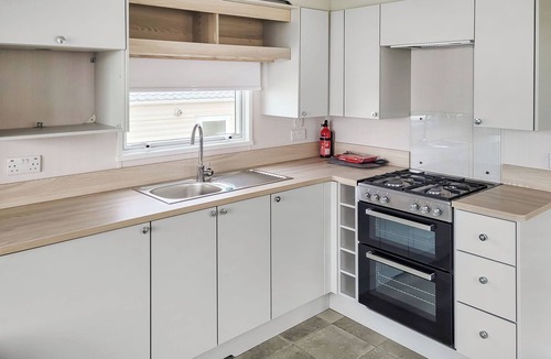 Swyre House | This comfortable stylish caravan offers beautiful sea and country views.