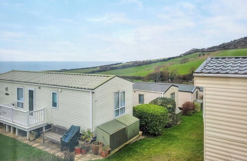 Swyre House | This comfortable stylish caravan offers beautiful sea and country views.