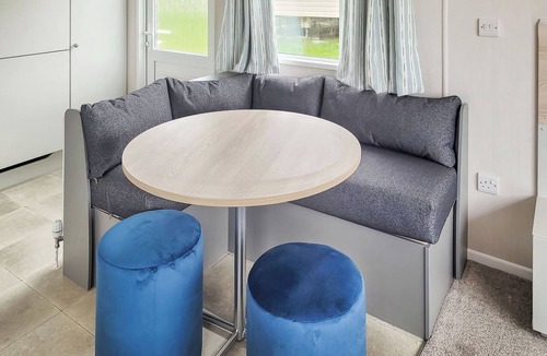 Swyre House | This comfortable stylish caravan offers beautiful sea and country views.