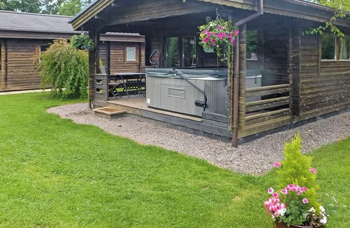 Cullompton Ski Chalet | Timber lodge with one queen size double and one twin.