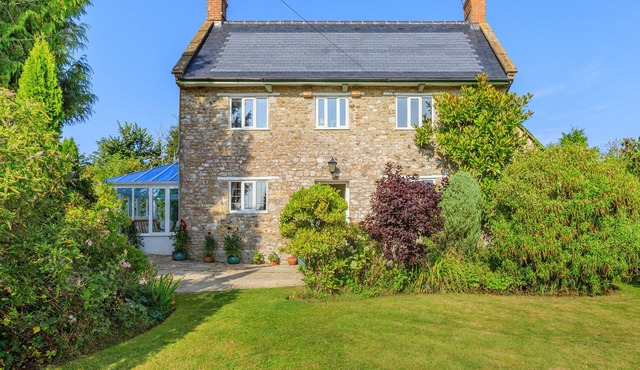 Charming four-bed holiday home in Yarcombe sleeps eight.