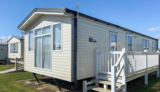 Comfortable modern 12ft-wide caravan with one double and two twin.