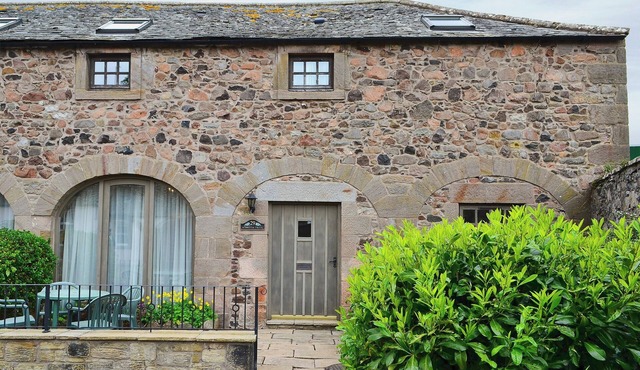 Converted stable block at the foot of the Cheviots between coast and country.