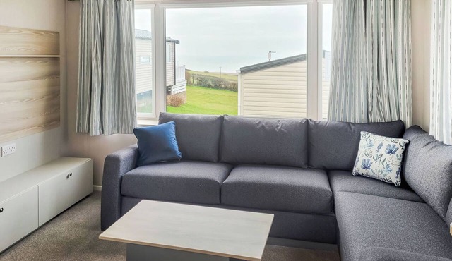 This comfortable stylish caravan offers beautiful sea and country views.